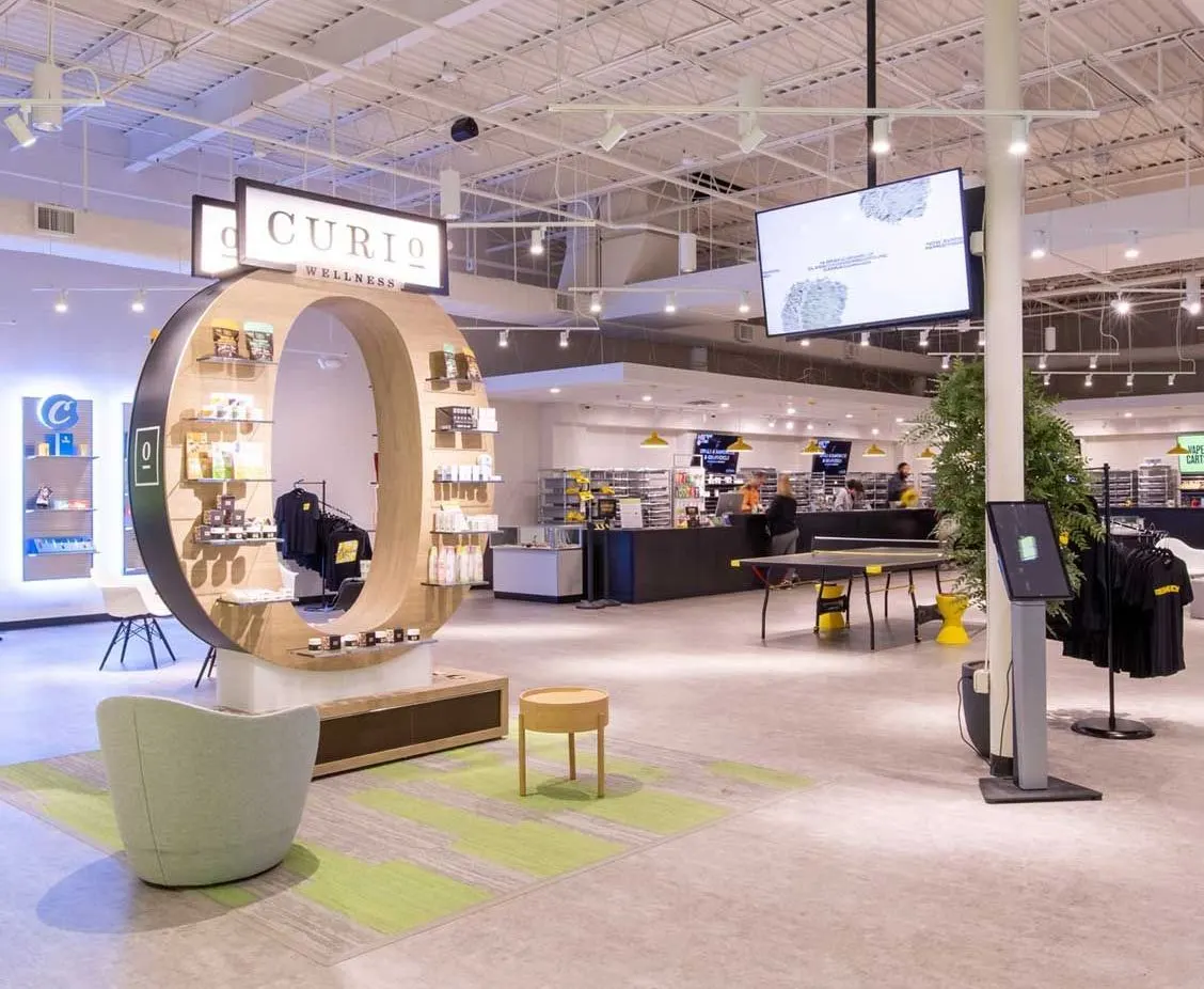Modern cannabis dispensary interior with Curio circular display and lounge area
